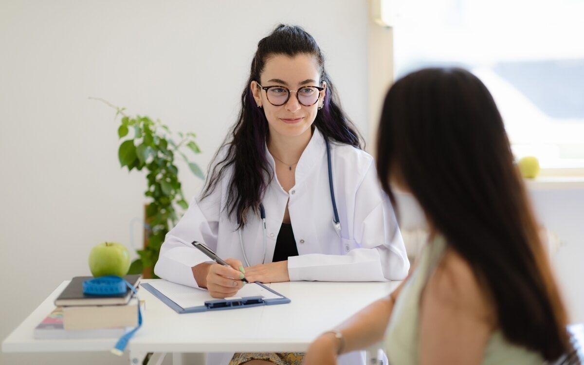 Provider talking with patient during first medical weight loss appointment